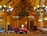 Log stair connects to second loft with views overlooking great room.