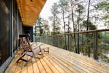 Outdoor, Front Yard, Decking Patio, Porch, Deck, Boulders, Woodland, Wood Patio, Porch, Deck, Trees, Metal Patio, Porch, Deck, Slope, and Shrubs primary deck  Photo 7 of 11 in White Pine Retreat by Fletcher Noonan