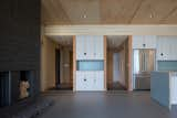 Living Room, Linoleum Floor, Standard Layout Fireplace, Recessed Lighting, Bookcase, and Ceiling Lighting interior  Photo 11 of 11 in White Pine Retreat by Fletcher Noonan