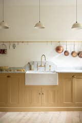 Kitchen, Marble Counter, Light Hardwood Floor, Marble Backsplashe, Colorful Cabinet, Pendant Lighting, and Drop In Sink  Photo 2 of 12 in The Stoke Newington Kitchen by deVOL Kitchens