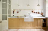 Kitchen, Marble Counter, Pendant Lighting, Colorful Cabinet, Marble Backsplashe, Light Hardwood Floor, and Drop In Sink  Photo 4 of 12 in The Stoke Newington Kitchen by deVOL Kitchens
