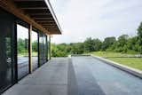 Concrete pool along side living room