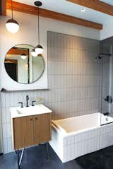 Bath Room, Concrete Floor, Ceiling Lighting, Corner Shower, Wall Mount Sink, and Ceramic Tile Wall Guest bathroom  Photo 11 of 20 in Hudson Woods Pool House by Matt Kowalewski