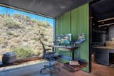 Office, Chair, Desk, Concrete Floor, and Shelves  Photo 6 of 20 in Hidden Valley Desert House by Matt Kowalewski