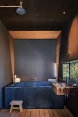 Bath Room, Wood Counter, Wall Mount Sink, Floor Lighting, Bamboo Floor, Freestanding Tub, and Open Shower  Photo 13 of 20 in Hidden Valley Desert House by Matt Kowalewski