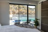 Bedroom, Bed, Chair, and Night Stands View of pool from bedroom   Photo 9 of 17 in Modern Oasis in Joshua Tree by Matt Kowalewski