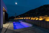 Night view of pool   Photo 10 of 17 in Modern Oasis in Joshua Tree by Matt Kowalewski