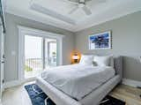 Bedroom with balcony and beach views