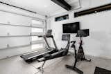 Home gym with Peloton  Photo 16 of 21 in Ski-in Ski-out Chateau in Vail by Matt Kowalewski