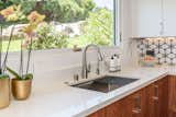 31½-inch undermount stainless steel workstation sink sits beneath the expanded window.