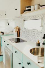 Kitchen, Drop In, Wood, Cooktops, Wood, Wood, Laminate, Wall, Refrigerator, and Colorful All the amenities packed into a caravan.  Kitchen Wood Cooktops Colorful Photos from Marlow the Majestic