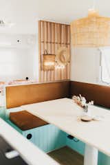 Dining Room, Table, Storage, Pendant Lighting, and Bench An L bench that double as another sleep space.  Photo 4 of 14 in Before & After: A Beloved Family Camper Gets a Minty Fresh Makeover from Marlow the Majestic