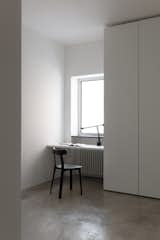 Bedroom, Wardrobe, Ceiling Lighting, Concrete Floor, Chair, and Table Lighting  Photo 1 of 12 in House T by Giuseppe Parisi