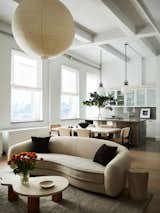 A view of the living room across the boucle curved sofa