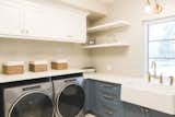 Laundry room with lots of storage and large farmhouse sink