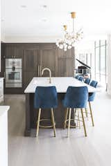 Custom state-of-the-art kitchen with two-tone cabinetry, a large kitchen island and Gaggeneau Appliances 