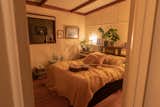 Bedroom, Light Hardwood Floor, Bed, and Ceiling Lighting Cosy main bedroom   Photo 10 of 43 in Tasman Cottage by Nick Green