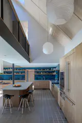Drew and Dina got the open kitchen they wanted. The shelves are exposed to display ceramics they make at the studio on the property.