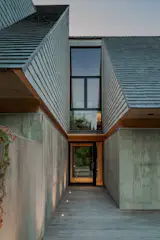 The breezeway is still see-through, but now is enclosed along with the rest of the home.