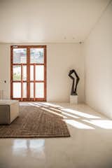 Hallway, Concrete Floor, and Rug Floor front door   Photo 2 of 16 in THE AVEN by Jelle Vans photography