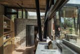 Kitchen, Marble Counter, Terrazzo Floor, and Wood Cabinet  Photo 14 of 21 in A Cluster of Earthy, Stone-Built Huts Form a Far-Out Retreat in Greece from Meganisi House