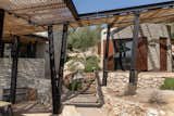 Exterior, Metal Roof Material, House Building Type, Shed RoofLine, and Stone Siding Material  Photo 1 of 49 in Meganisi House by Hiboux Architecture