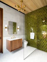 Heath Tile in the interior bathrooms and kitchen left the private spaces textured, colorful and intimate which was intended to complement the minimal palette of the main spaces of the home.
