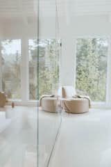 A JB Lounge chair made by Bright Chair sits near a window in the living room. 