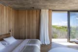 According to Daniela, a simple material palette was important. "The kids are coming and going all the time," she says, so all bedrooms are made up with the same linens, "much like a hotel."