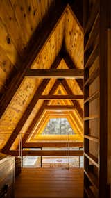 The A-frame is constructed with treated pine; its knots and other imperfections add character to the space. 