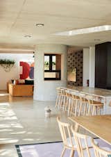 The concrete fireplace doubles as a source of heat and a structural element. Originally, Katz planned to plaster the fireplace with cement to create an ultra-smooth surface, but once the design team saw the initial roughness, they liked the look and decided to keep it. "It looks like a rock formation in the living room," he says.