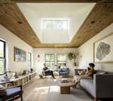 The original ceiling, made from old-growth pine, adds warmth to the living room, balancing out the white walls and salvaged white oak flooring. 