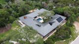 Another move that reduces the house's environmental impact is the inclusion of photovoltaic panels on the roof. The panels generate enough energy to offset 95% of the house’s consumption.