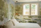 The bedroom ceiling was painted with Portola Paint's Eastwood lime wash to balance the detailed wallpaper on the walls. 