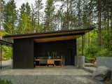 Tucked into one end of the garage, a potting area is a favorite of Joan, who is an avid gardener and plant lover. The design team used leftover cedar from the ceilings to create the work surface.