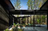 A walkway of pavers leads from the garage to the front door; it’s covered with a steel canopy meant to amplify the sound of North Bend’s frequent rainfall. 