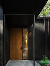 Architect Mark Johnson has long been inspired by the texture produced by traditional Indigenous canoe carving. The design team worked with Jim Barker at British Columbia woodworking studio Barker Manufacturing, to produce Ken and Joan’s cedar door. Its texture was produced using a CNC adze. 