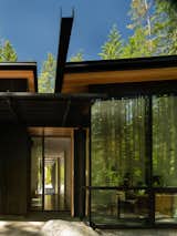 The roofs were designed to guide water to the steel channels, which run the entire width of the house. Joan’s painting studio sits nears the back door, where she can easily step out for fresh air or inspiration.