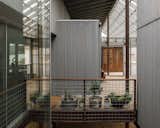 A void at one end of the foyer brings fresh air and natural light into the house. 