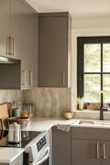 Kitchen view: ADU custom cabinetry by local craftsperson, paired with materials such as Richlite and Fibo 