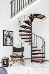The stairway leading to the primary suite balcony