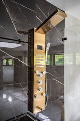 One of the two primary bathroom suite shower heads