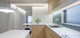Kitchen, Marble Counter, Medium Hardwood Floor, Wood Cabinet, Pendant Lighting, Tile Counter, Stone Counter, and Wood Counter  Photo 1 of 20 in S Apartment 602 by HARUKI OKU DESIGN