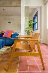 Living Room, Chair, Ceramic Tile Floor, Ceiling Lighting, and Light Hardwood Floor  Photo 5 of 21 in General Artigas apartment by ana paula de castro