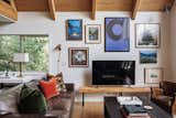 living room gallery wall featuring Nicholas Moegly original, Matthew Turke photograph, and Suzan Armstrong acrylic