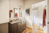 master bathroom with tartan accents and pendant light by Rejuvenation