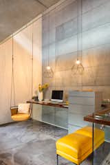 Electric yellow breaks the monotony of the minimalist interior