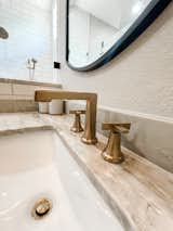 Champagne bronze sink faucet with quartz countertop   Photo 10 of 15 in Cloverleaf Bathroom by Selena Rosete