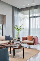 The elegant furniture pieces by the SAR design studio are carefully placed to contrast and blend with the twilight tints of blue and grey.


