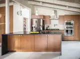 The original post and beam structure allowed us to strategically remove walls and open up the space for 21st century living.